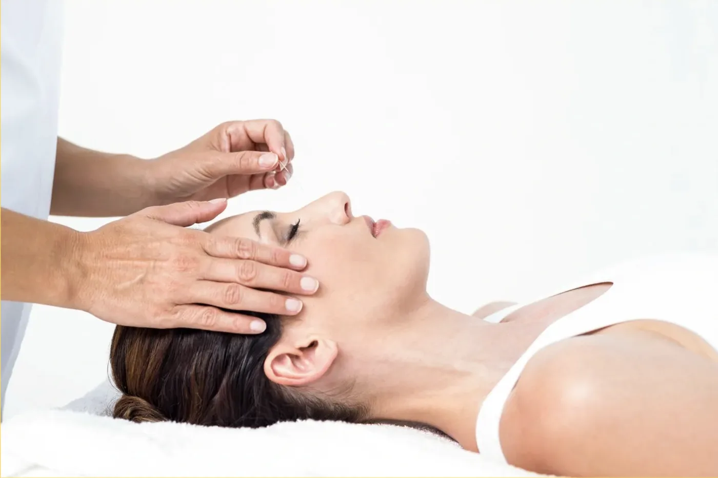Dr. Yasmin Harounian L.Ac providing caring and compassionate acupuncture treatment in her Los Angeles clinic