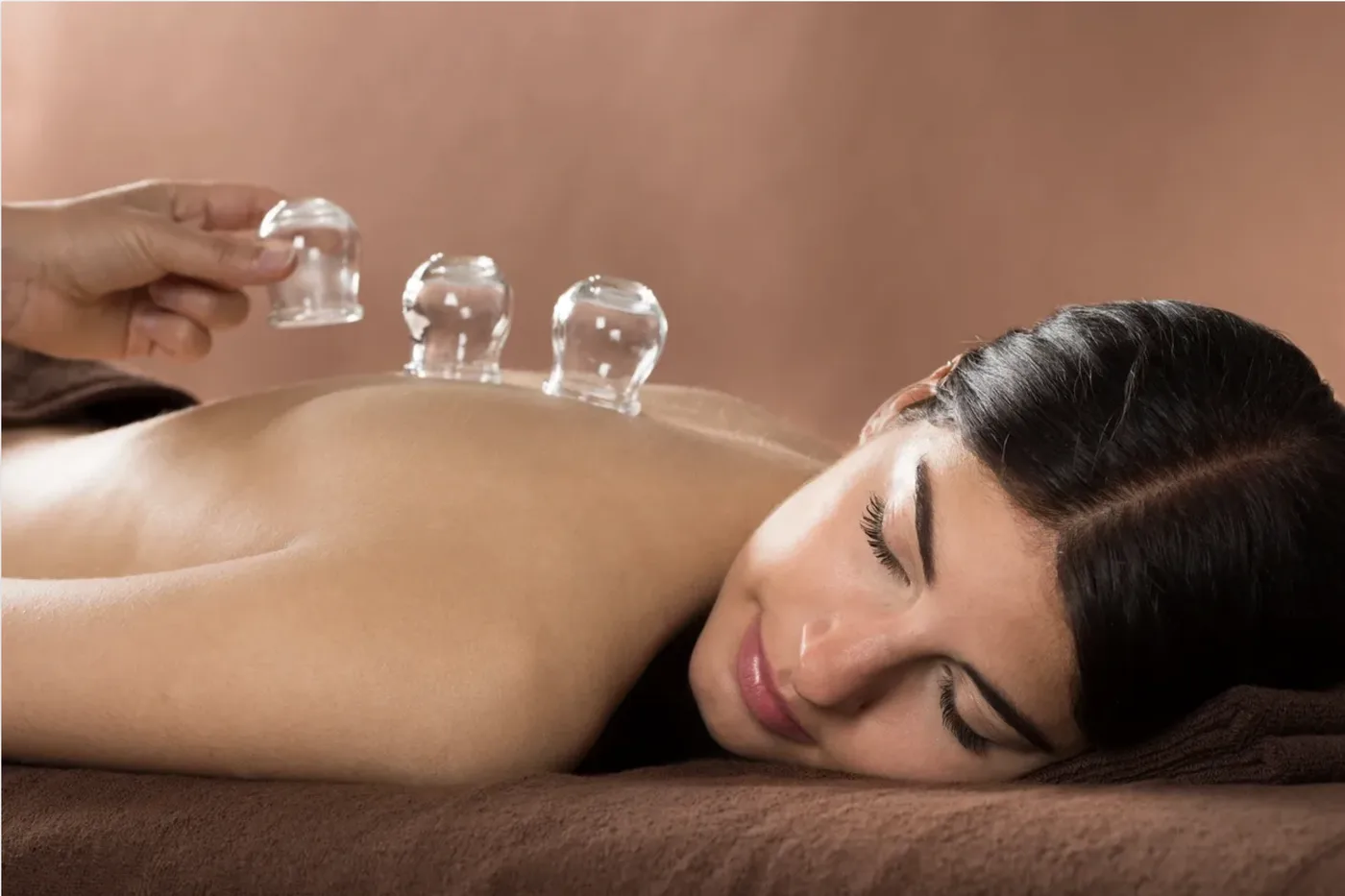 Dr. Yasmin Harounian performing lymphatic cupping therapy treatment in Los Angeles